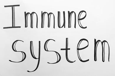 Photo of Phrase Immune System written on paper, closeup