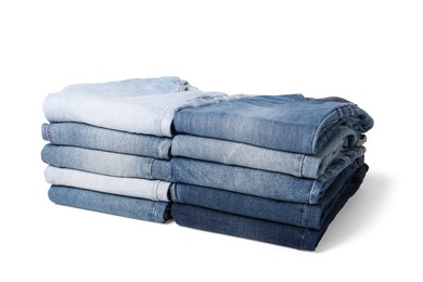 Image of Stacks of different folded jeans isolated on white