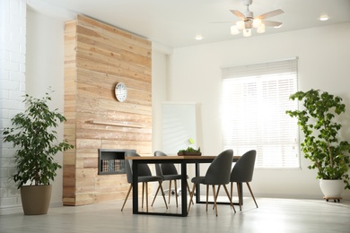 Modern meeting room interior with large table and chairs