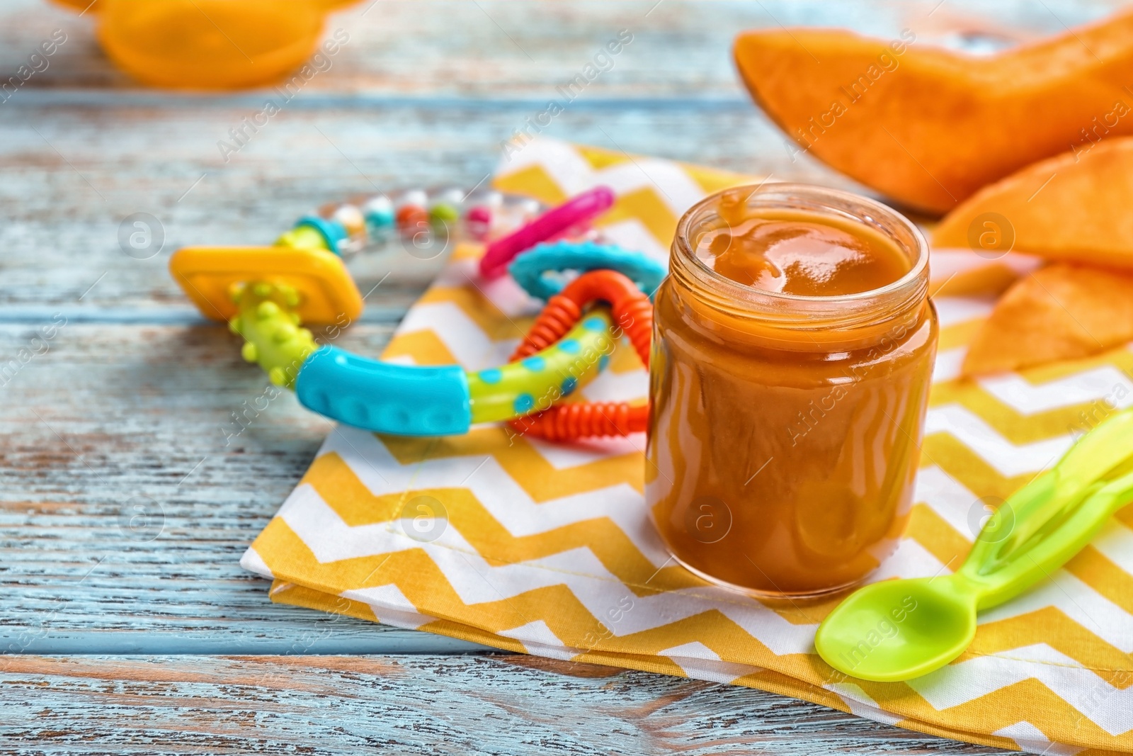 Photo of Jar with healthy baby food on table