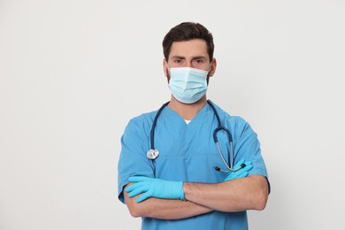 Photo of Nurse with medical mask and stethoscope on white background