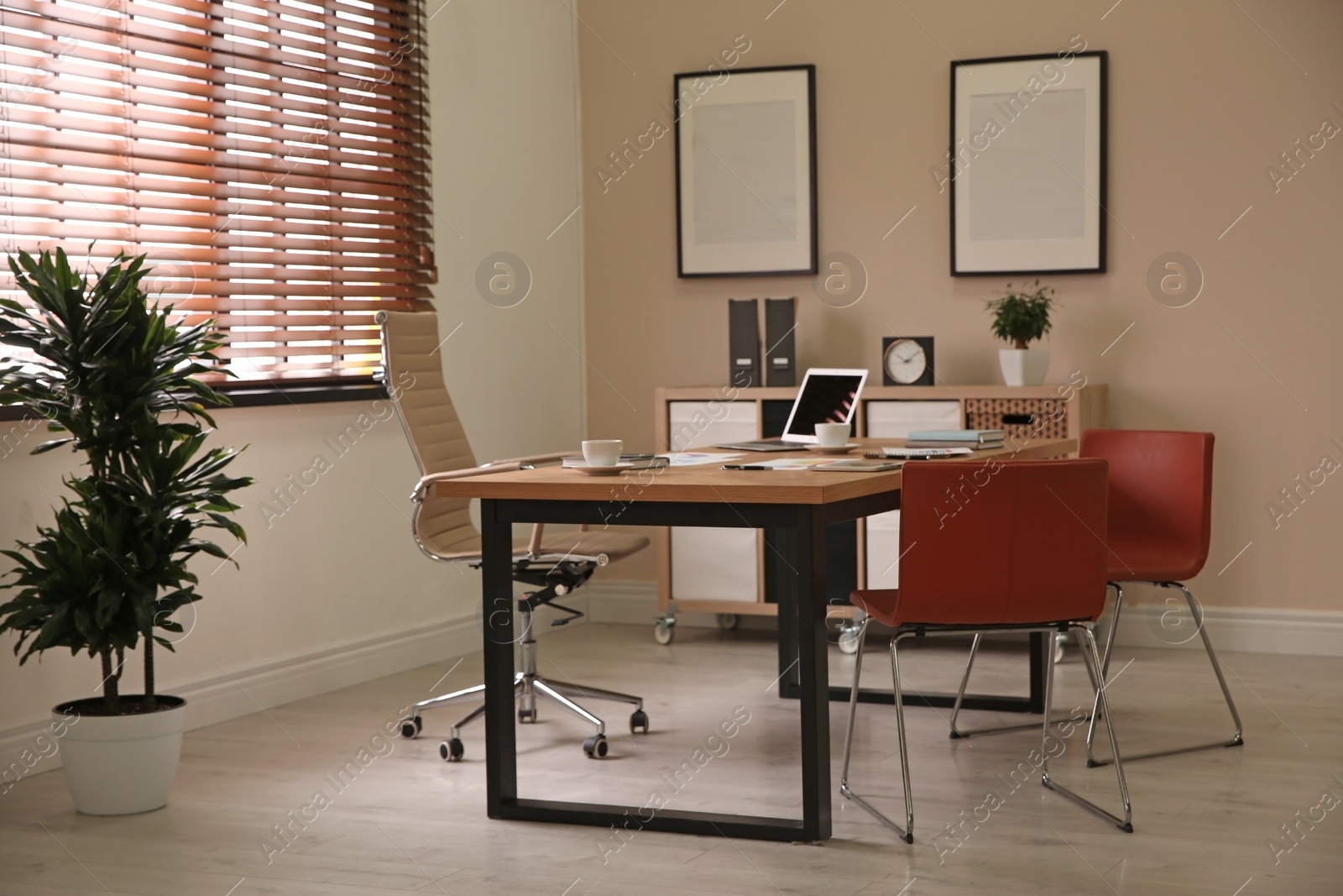 Photo of Director's office with large wooden table. Interior design