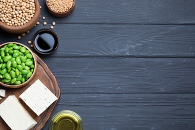 Photo of Different organic soy products on grey wooden table, flat lay. Space for text