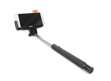 Selfie stick with mobile phone on white background