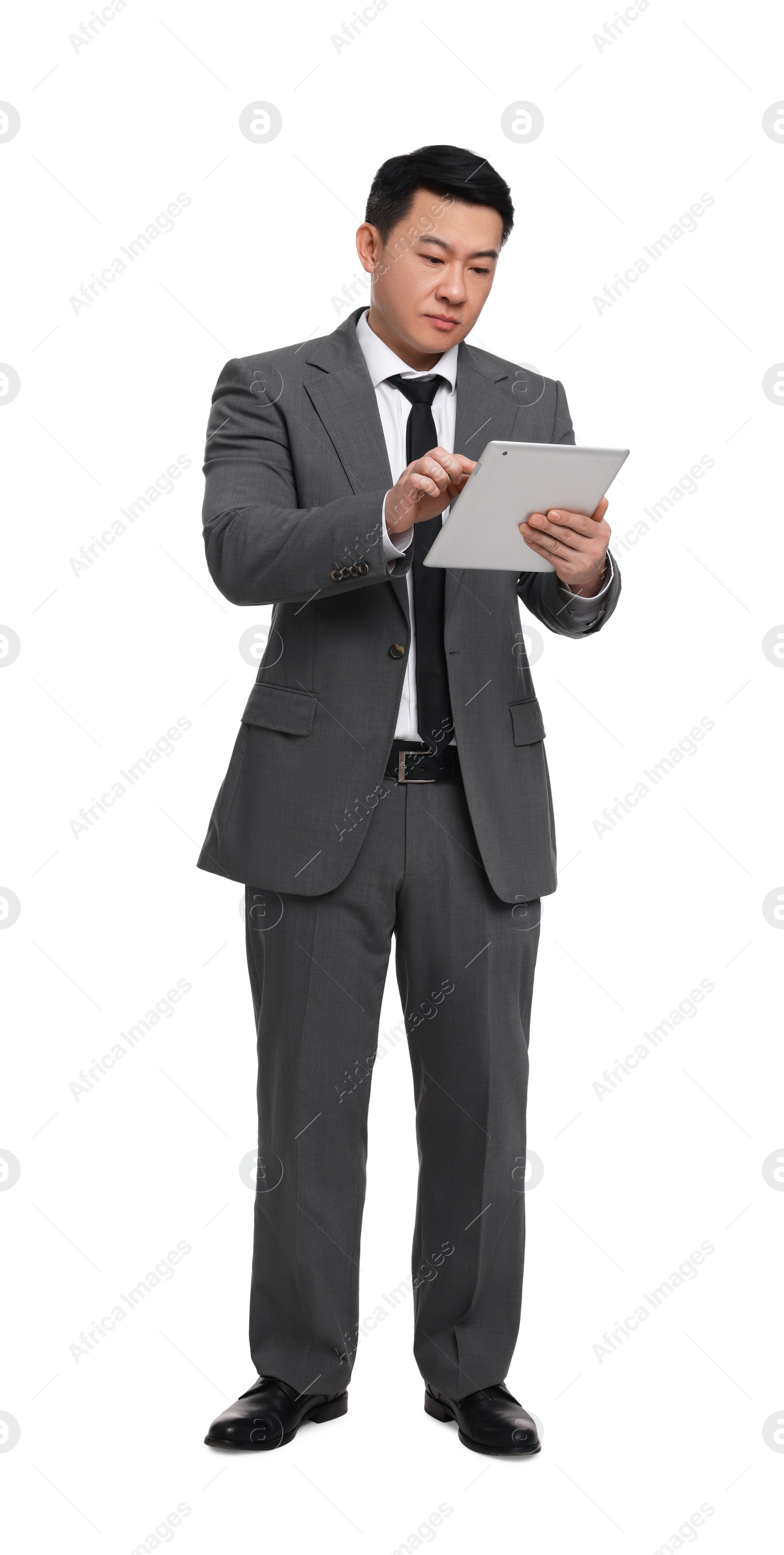 Photo of Businessman in suit using tablet on white background