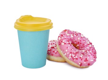 Photo of Two delicious donuts with sprinkles and hot drink isolated on white