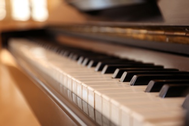 Black and white piano keys indoors, closeup