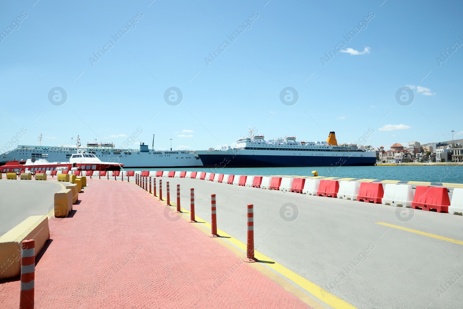 Photo of Picturesque view of port with road and modern boats on sunny day