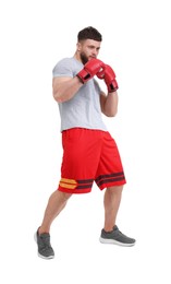 Photo of Man in boxing gloves fighting on white background