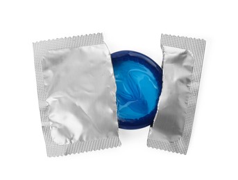 Photo of Condom in torn package on white background, top view. Safe sex