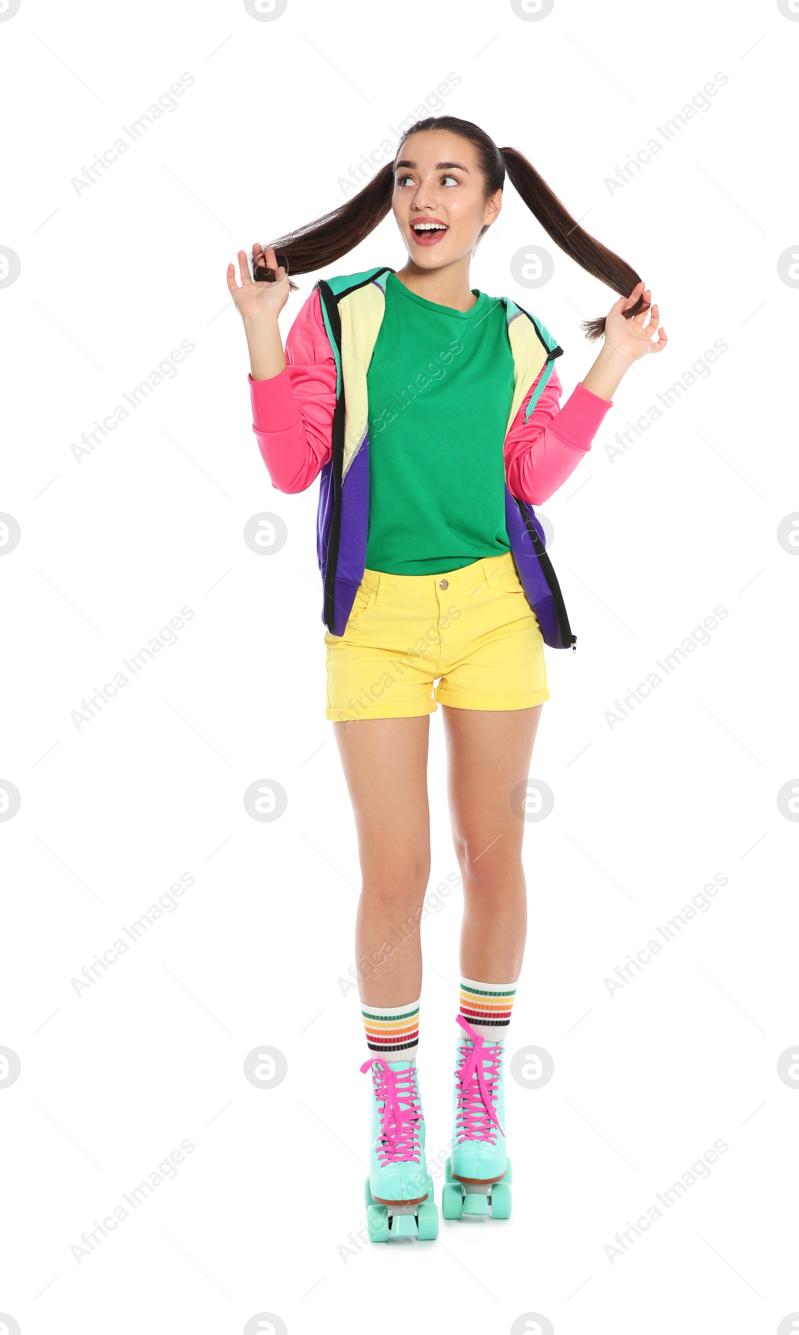 Photo of Full length portrait of young woman with roller skates on white background