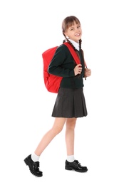 Photo of Full length portrait of cute girl in school uniform with backpack on white background