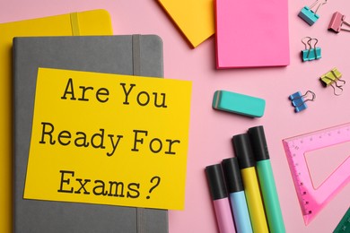 Photo of Sheet of paper with question Are You Ready For Exams? on pink background, flat lay
