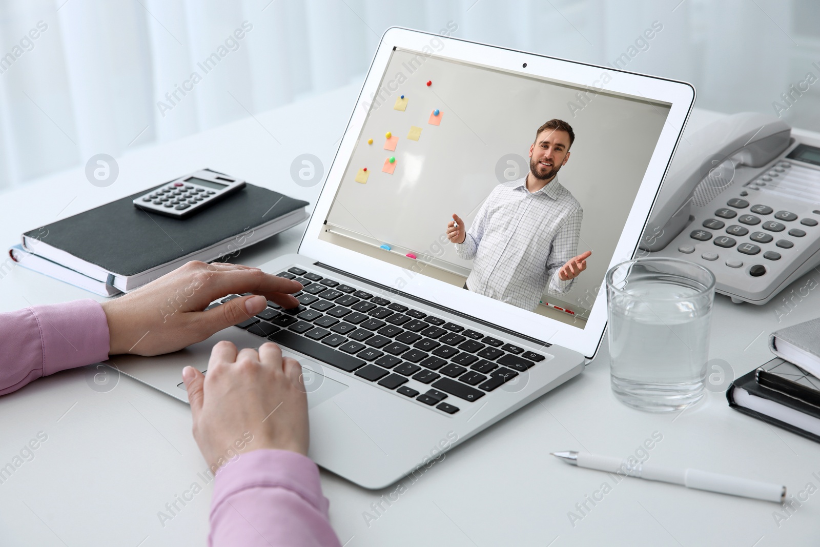 Image of Woman having online video consultation with business trainer at table, closeup