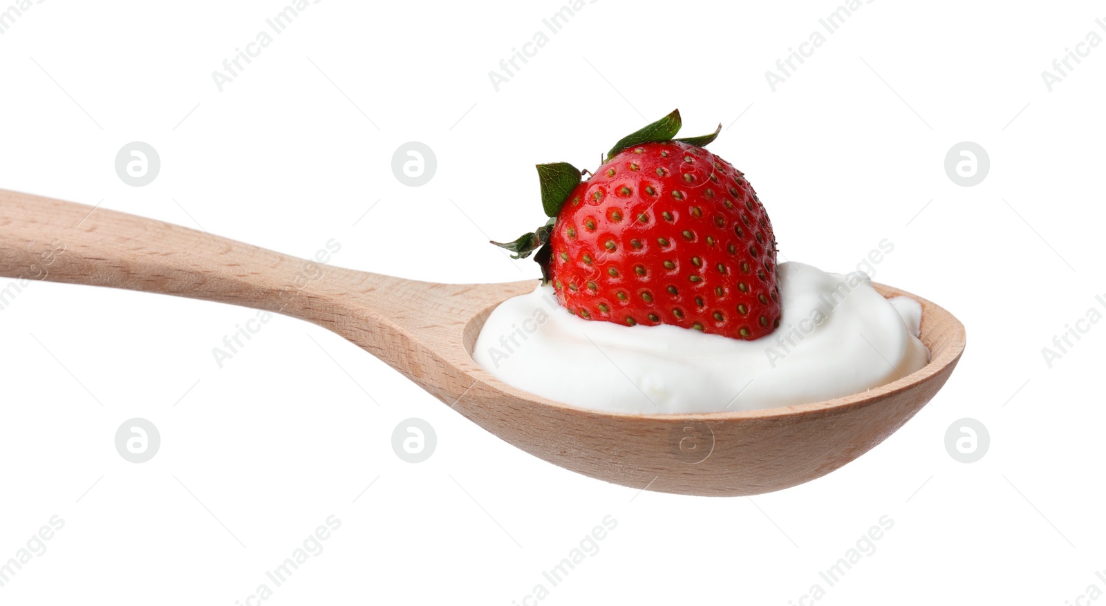 Photo of Wooden spoon with yogurt and strawberry isolated on white