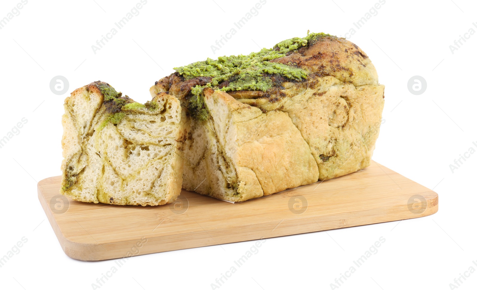 Photo of Wooden board with freshly baked pesto bread isolated on white