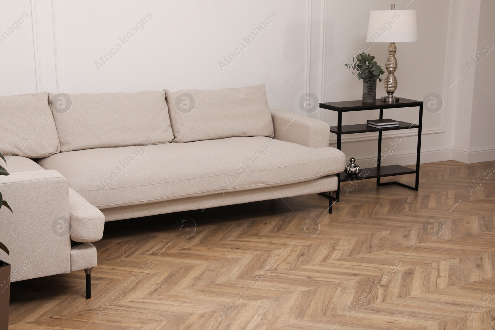 Photo of Modern living room with parquet flooring and stylish furniture