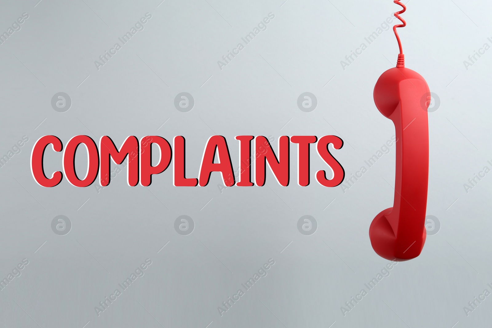 Image of Corded telephone handset and word complaints on light grey background