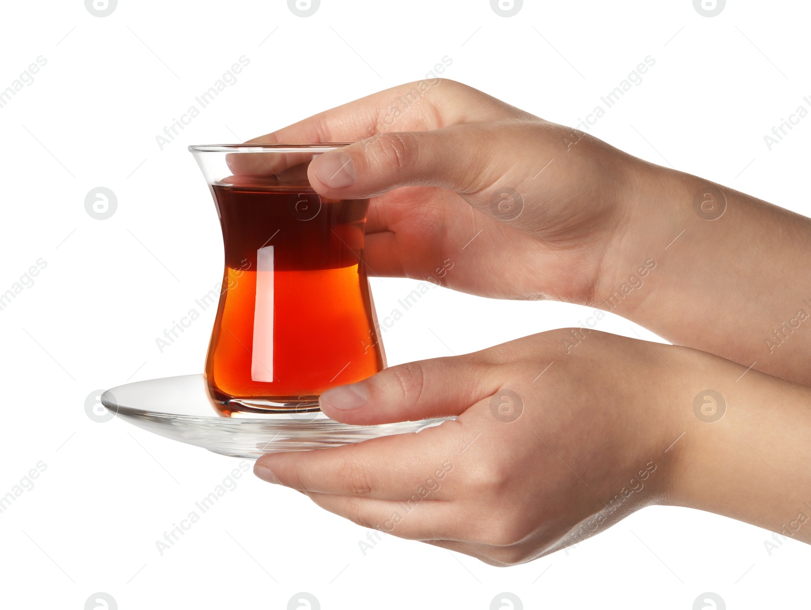 Photo of Woman holding glass of traditional Turkish tea on white background, closeup