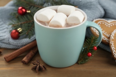 Composition with delicious marshmallow cocoa on wooden table