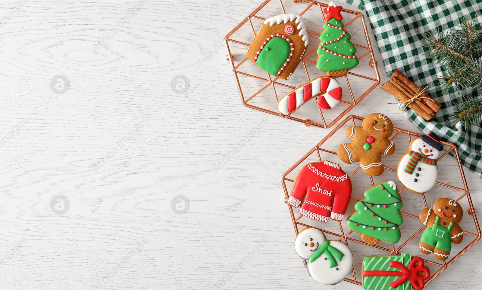 Photo of Flat lay composition with delicious homemade Christmas cookies on white table. Space for text