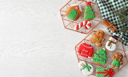 Photo of Flat lay composition with delicious homemade Christmas cookies on white table. Space for text