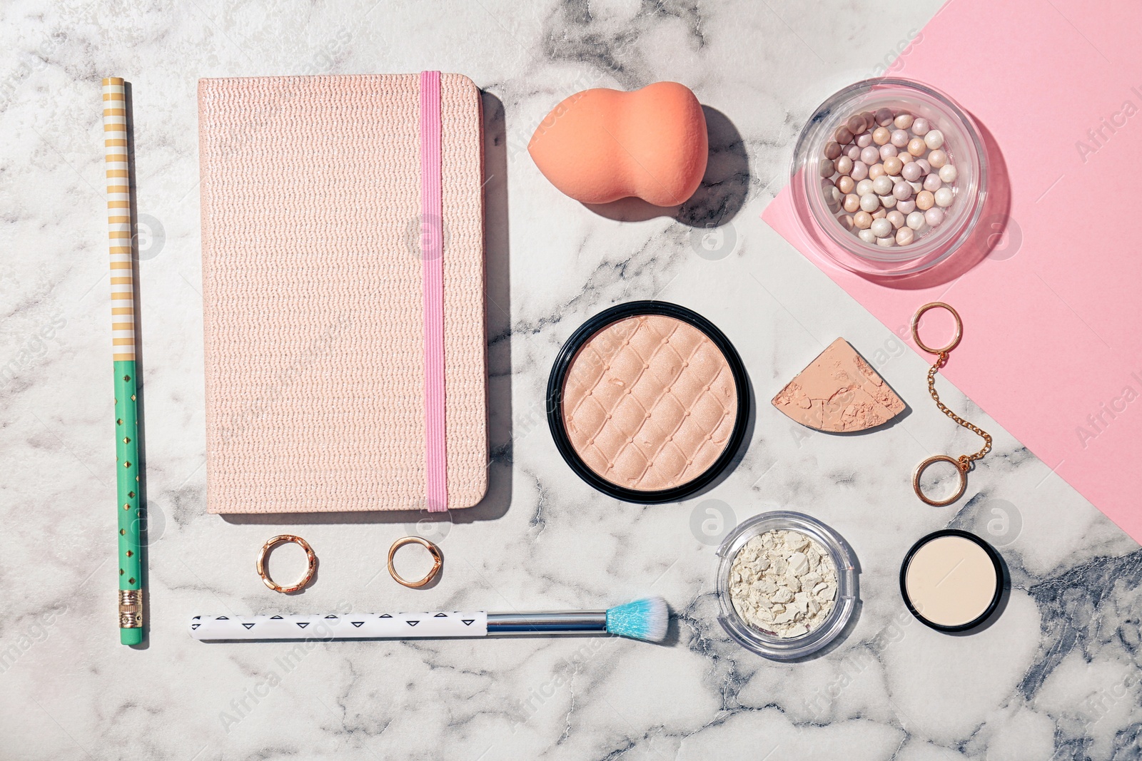 Photo of Flat lay composition with cosmetic products and notebook on light background