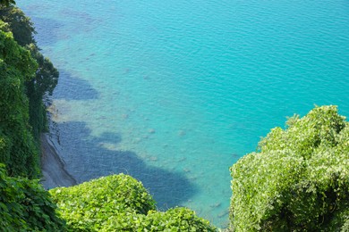 Photo of Picturesque view of green hills and sea with boat