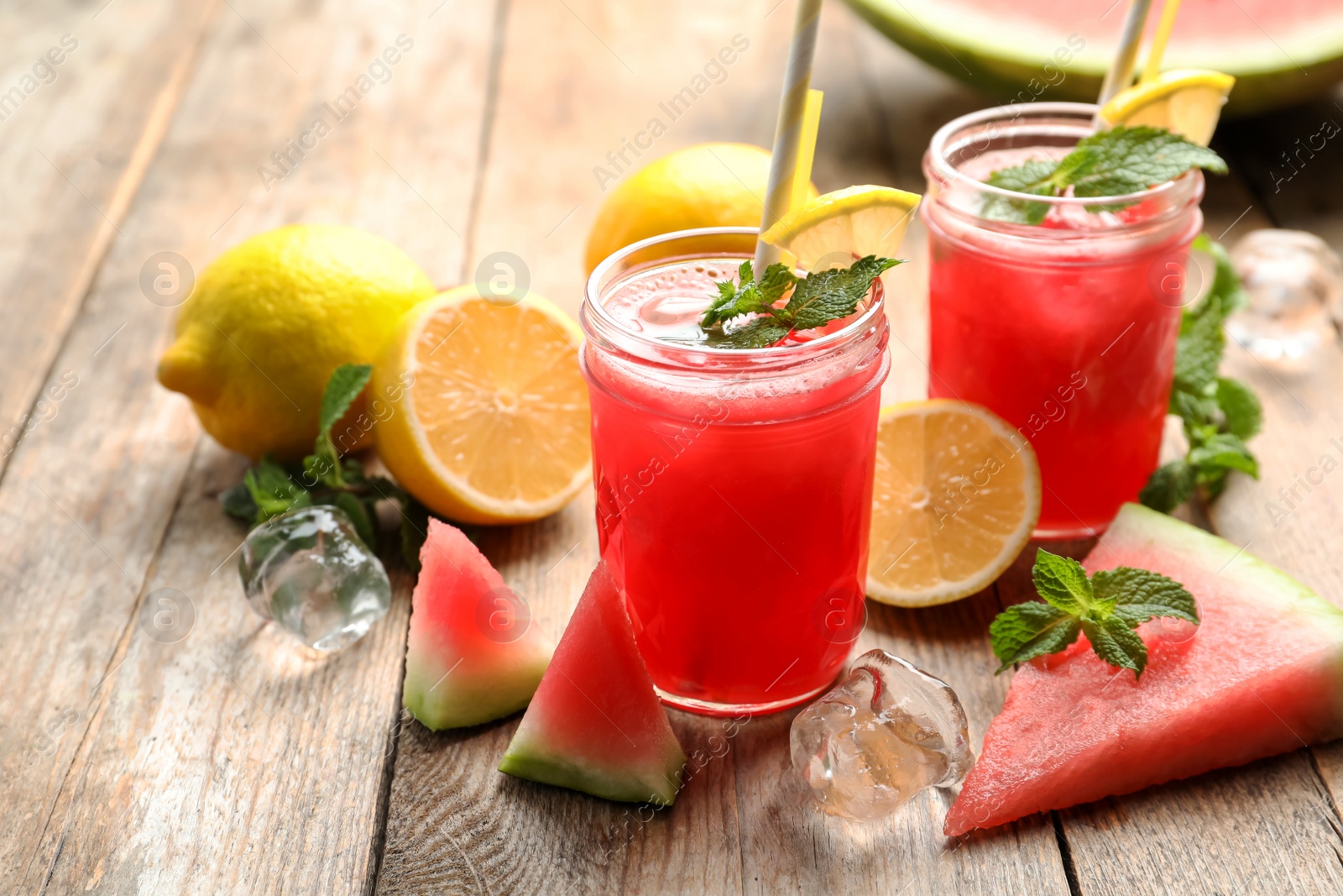 Photo of Delicious fresh watermelon drink on wooden table