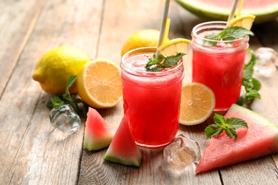 Photo of Delicious fresh watermelon drink on wooden table