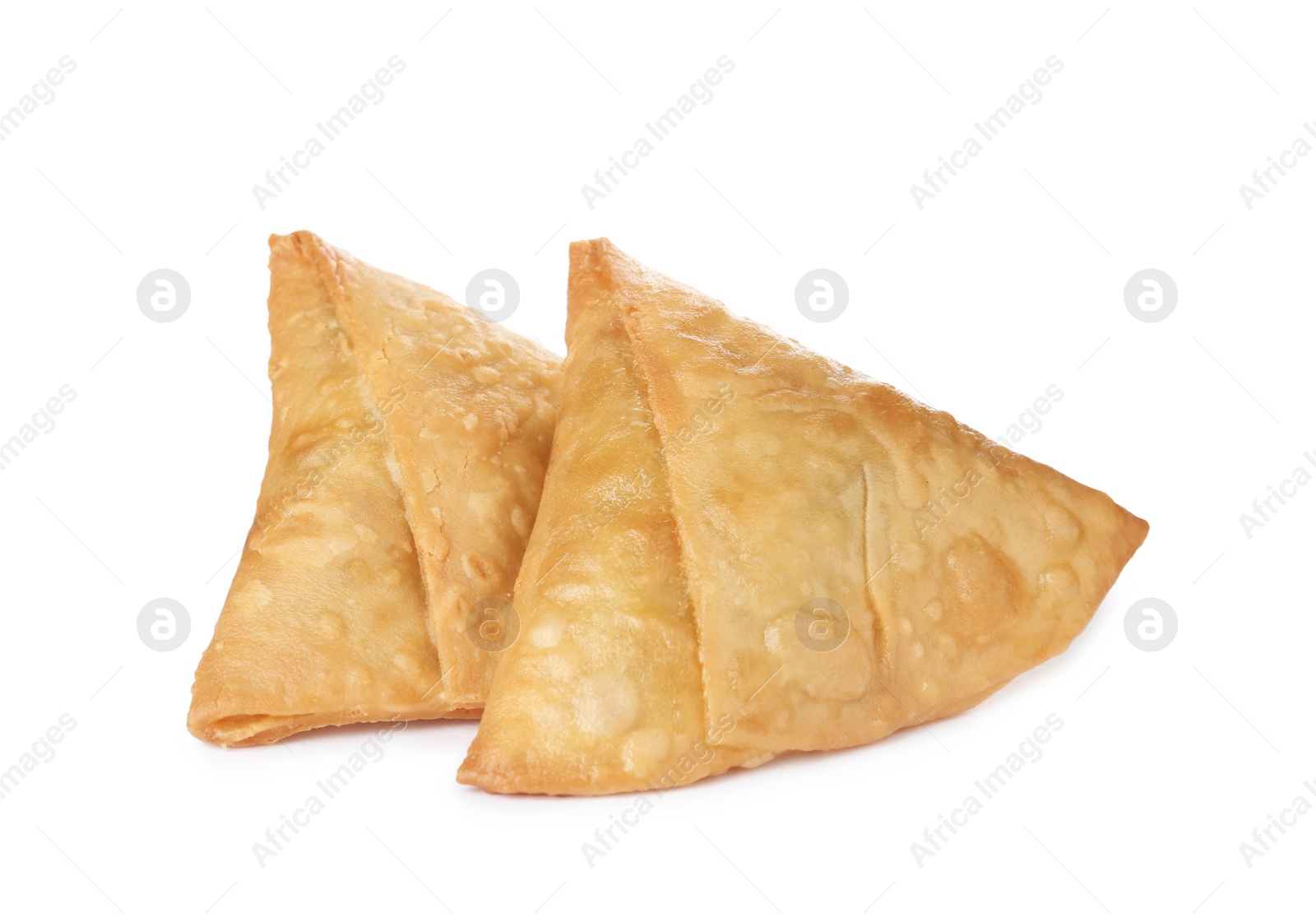 Photo of Fresh delicious crispy samosas on white background