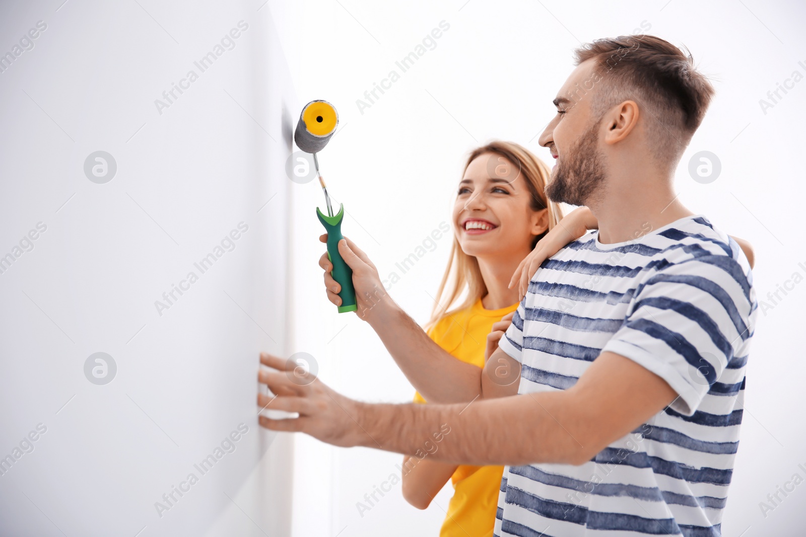 Photo of Young couple during apartment renovation, indoors