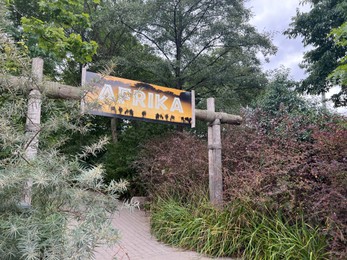 Rotterdam, Netherlands - August 27, 2022: Different plants, path and sign with word Africa written in Dutch