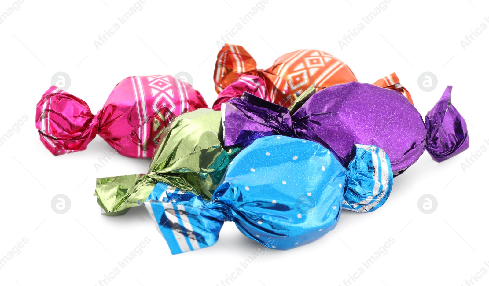 Photo of Sweet candies in colorful wrappers on white background