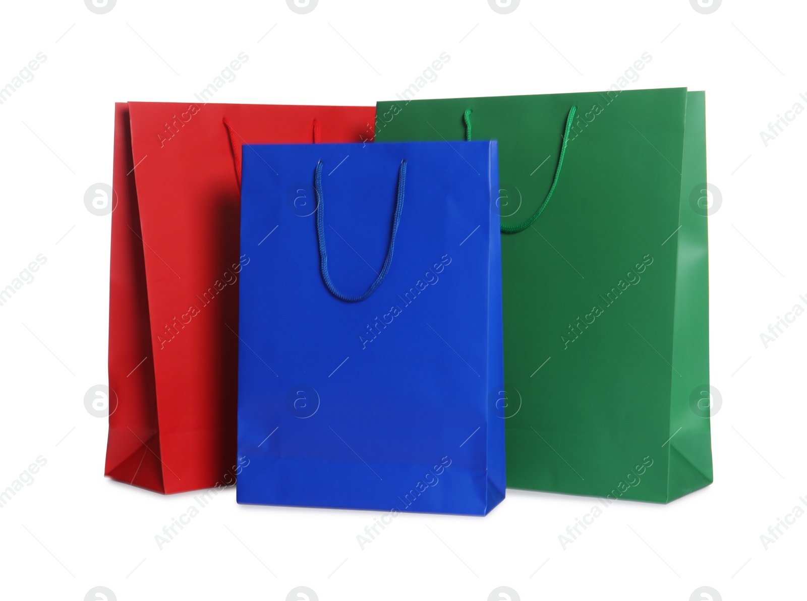 Photo of Colorful paper shopping bags isolated on white