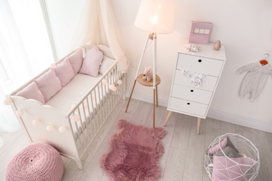 Interior of baby room with comfortable crib