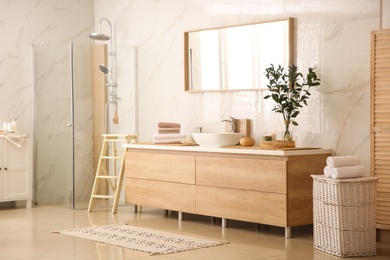 Modern bathroom interior with stylish mirror and vessel sink