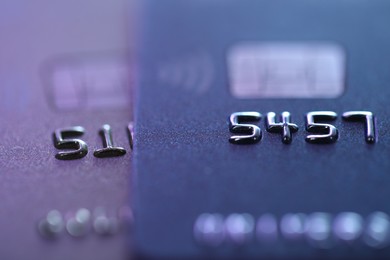 Two plastic credit cards as background, macro view