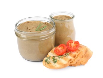 Photo of Glass jars with tasty liver pate, bread and tomato on white background