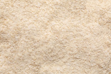 Photo of Brewer`s yeast flakes as background, closeup view