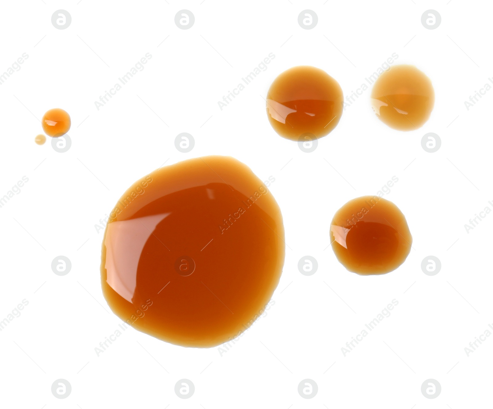 Photo of Tasty soy sauce isolated on white, top view