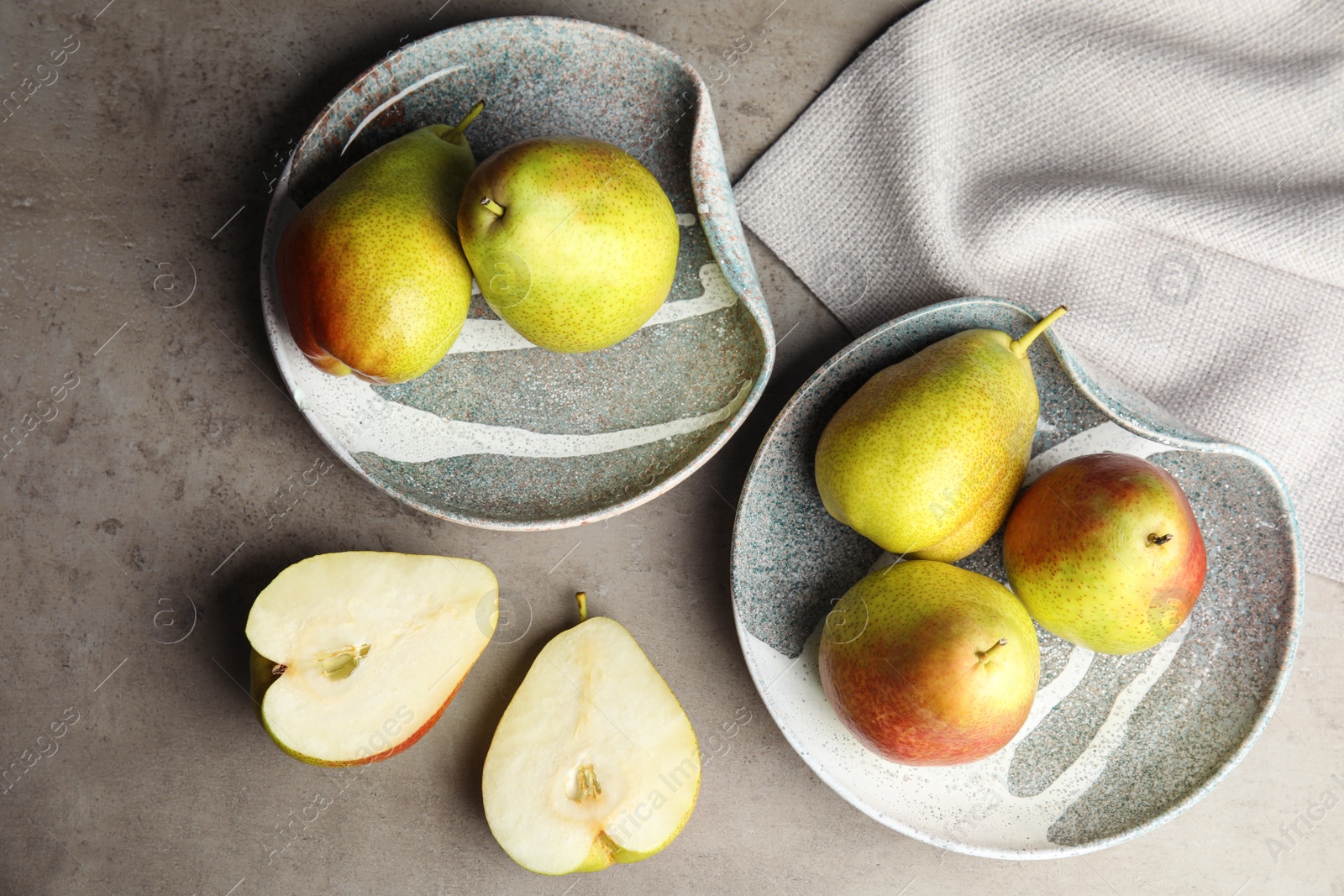 Photo of Composition with ripe juicy pears on grey stone table, flat lay