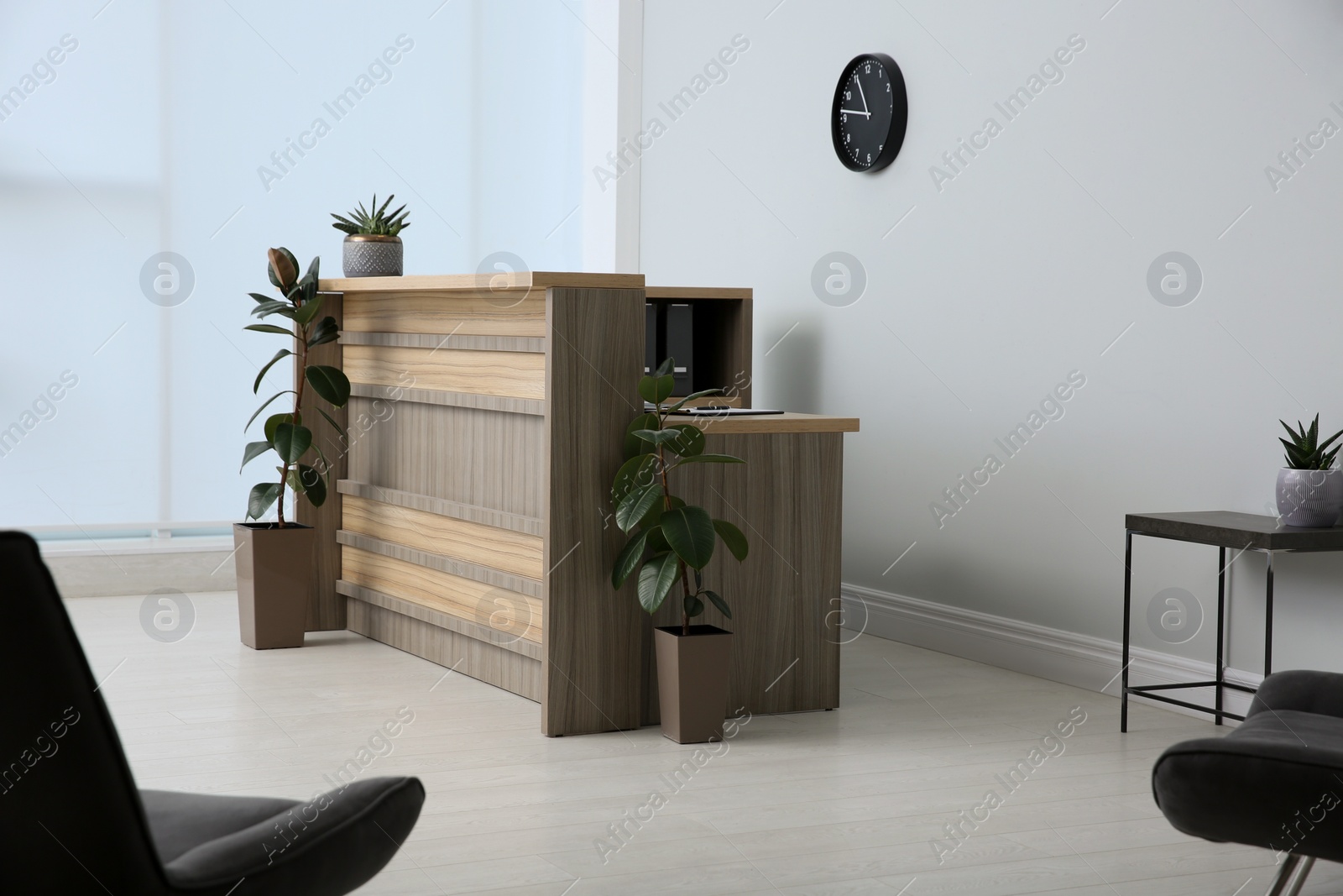 Photo of Lobby interior with stylish wooden receptionist desk