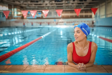 Photo of Young athletic woman in swimming pool