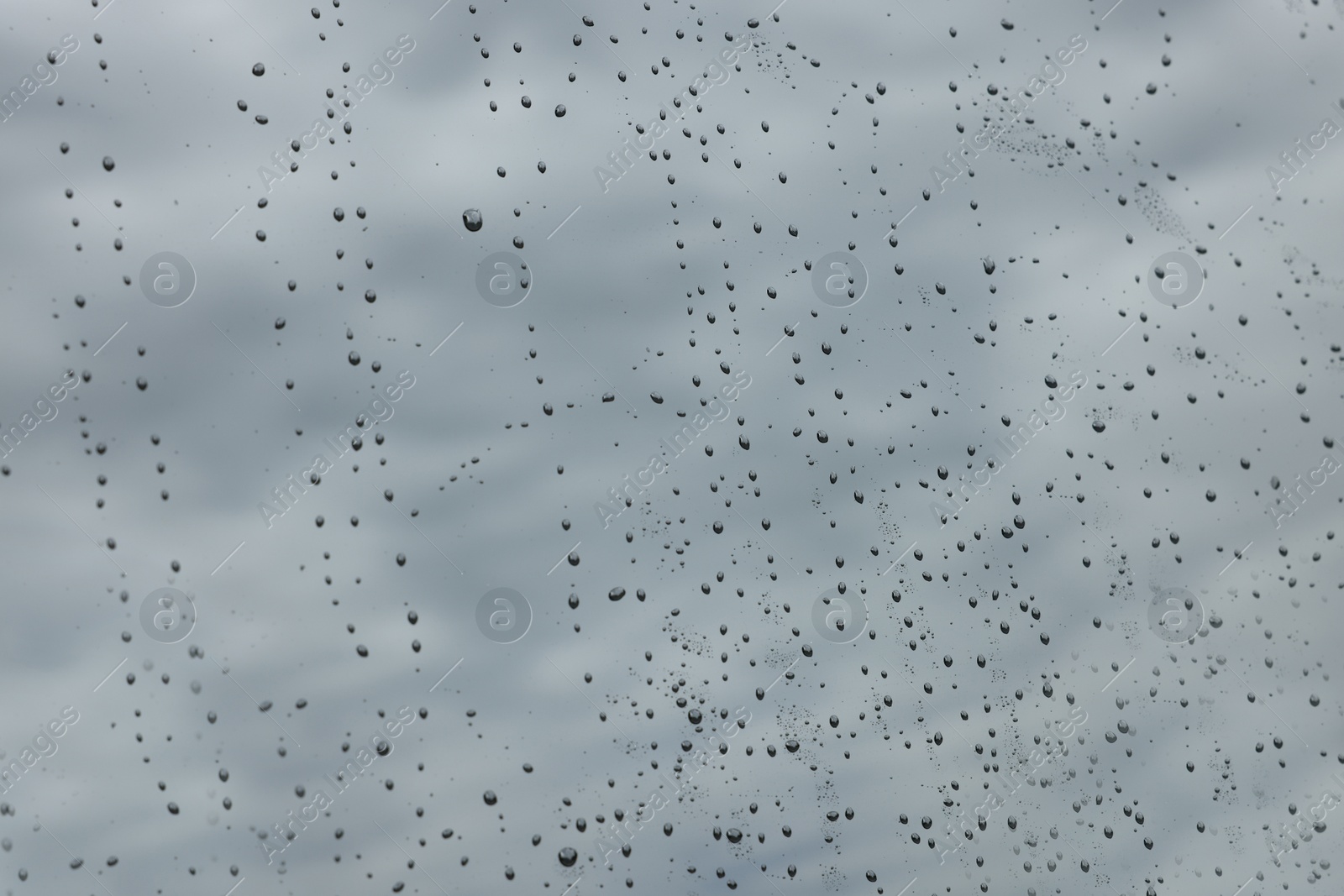 Photo of Drops of water on window glass as background, closeup