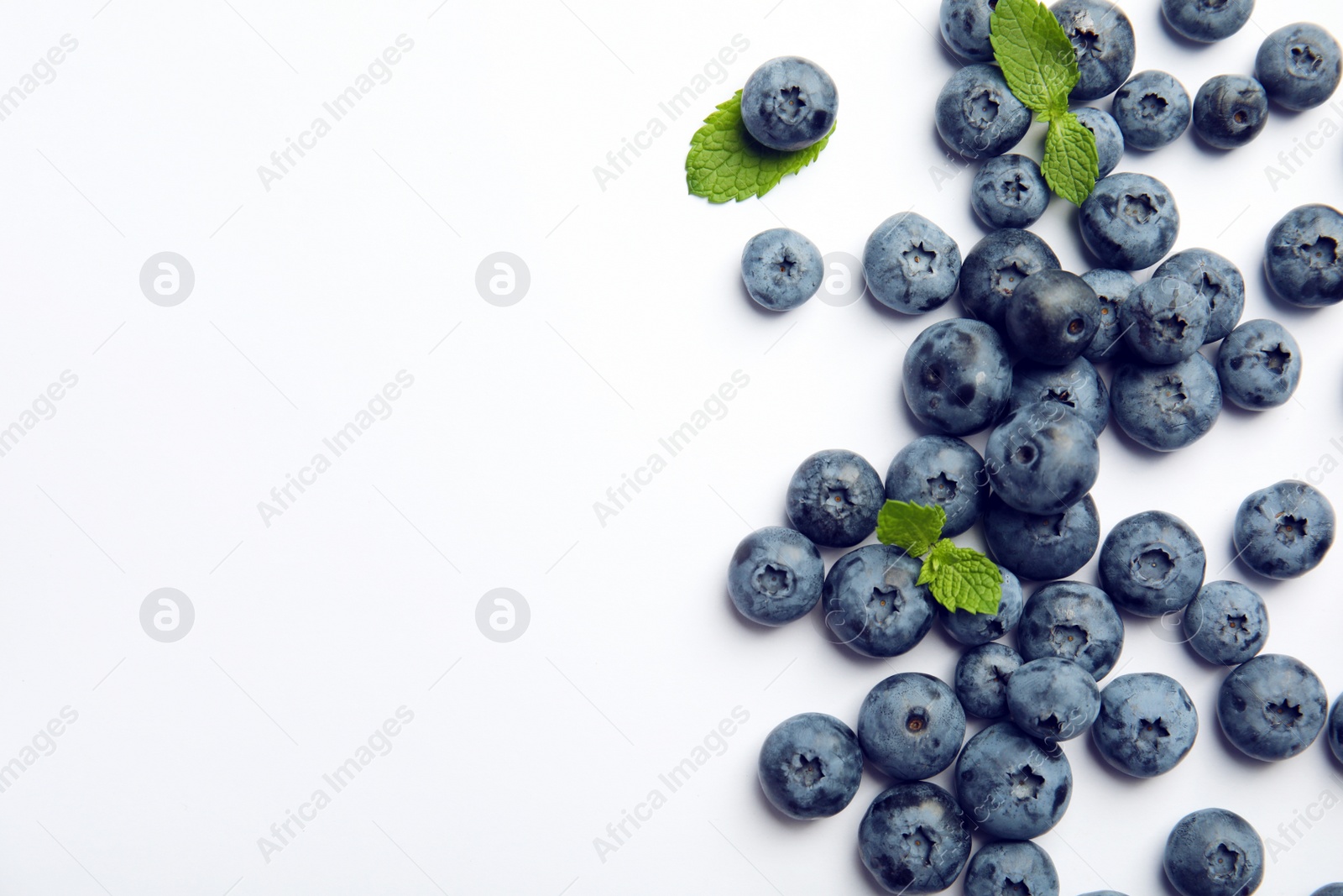 Photo of Flat lay composition with tasty blueberry and space for text on white background