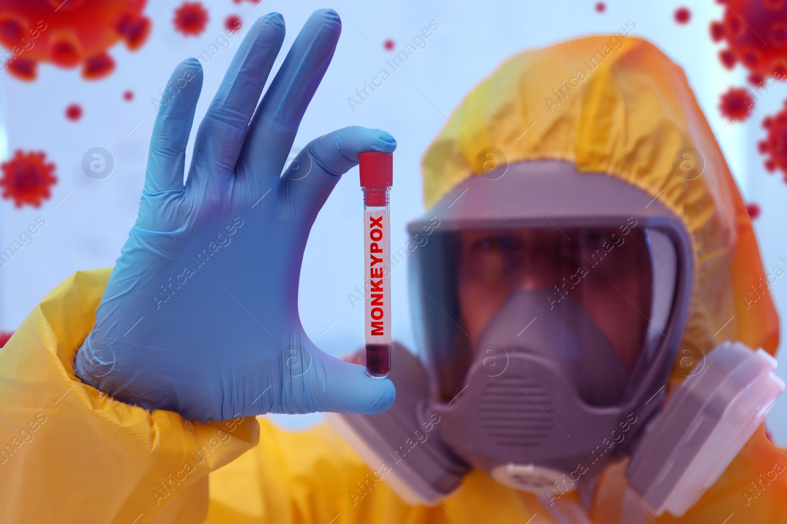 Image of Scientist in chemical protective suit holding test tube with blood sample. Monkeypox virus