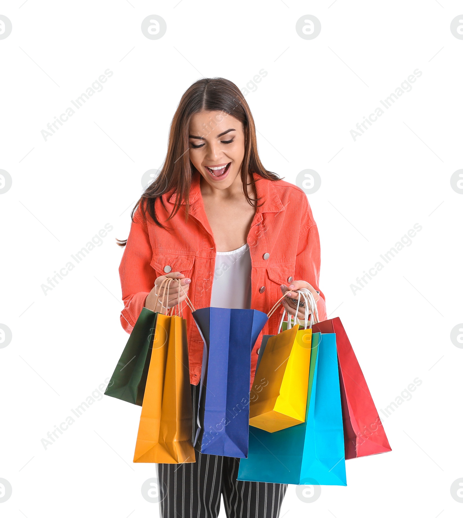 Photo of Young woman with shopping bags on white background