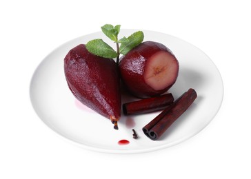 Photo of Tasty red wine poached pears with mint and cinnamon isolated on white