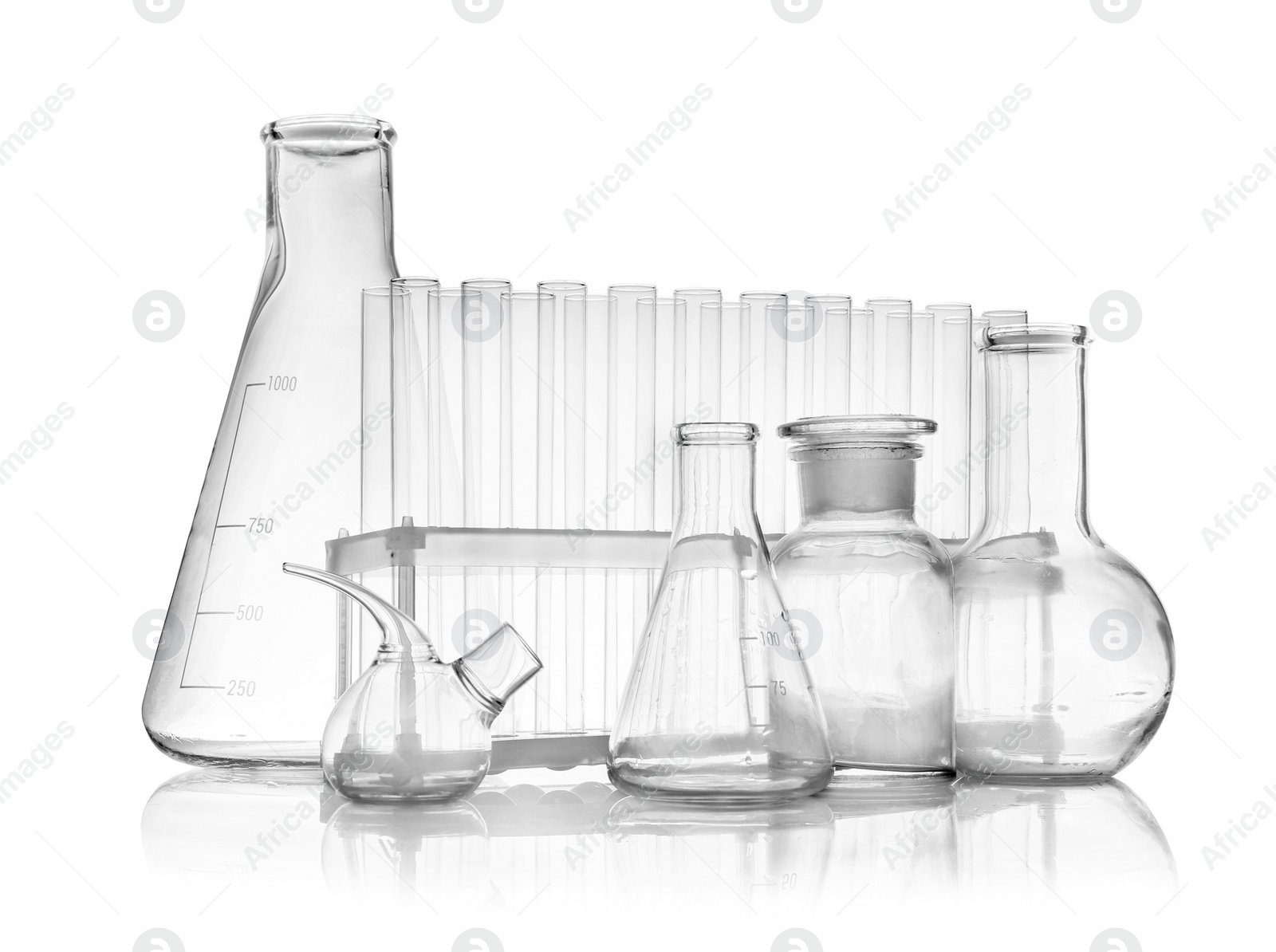 Photo of Set of empty laboratory glassware on white background